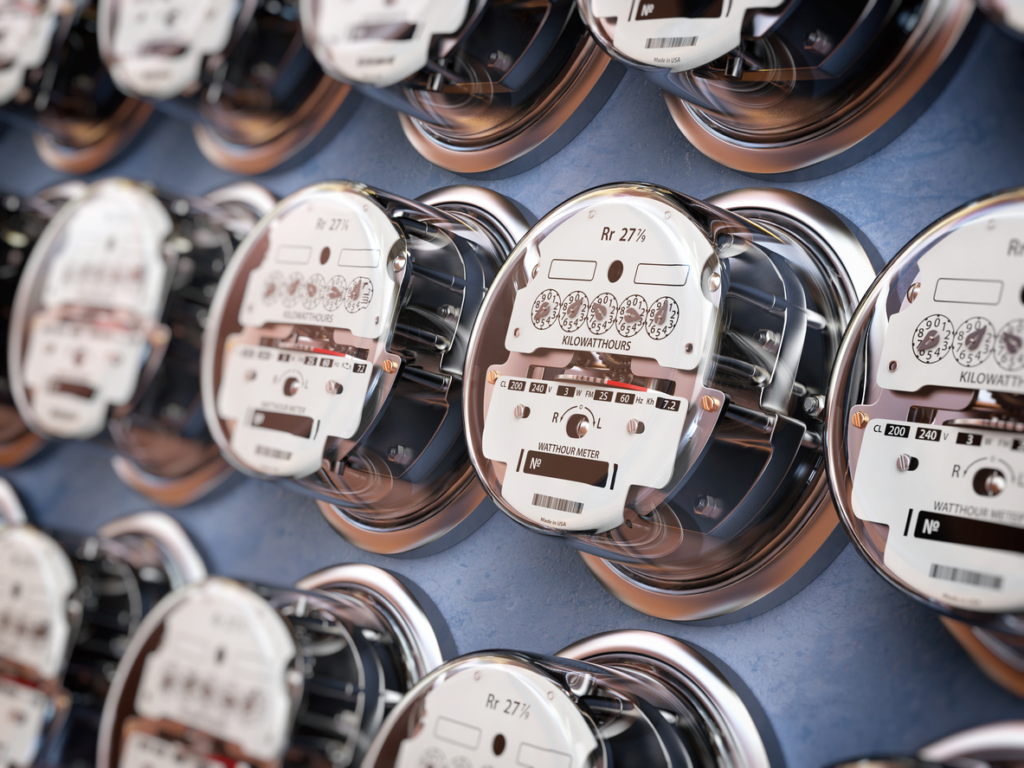 Close up of electric meters in a row measuring power use