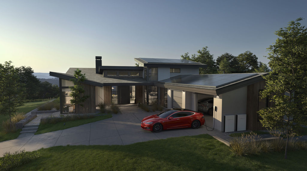 Modern home with a tesla charging and powerwall batteries installed