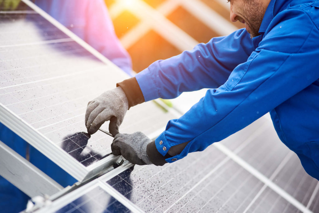 Finishing touches on a solar panel installation